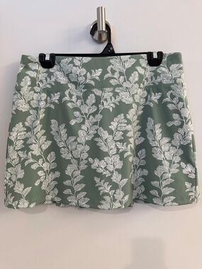 Laura Ashley Golf skirt. Size M. Green/cream color. Zipper pocket in back.